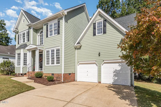 a backyard of a house with trees and houses