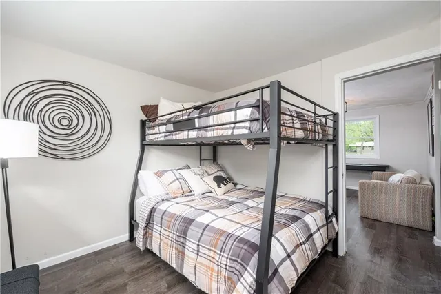 a bedroom with a bed and a chair