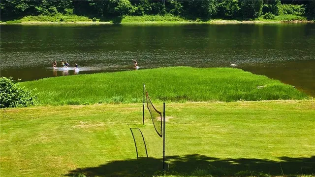 a view of a lake with a big yard