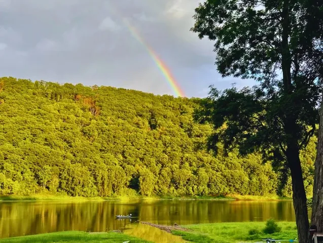 a view of lake with a yard