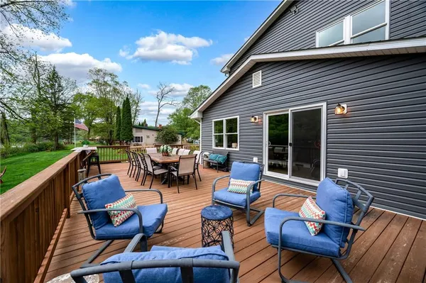 a view of a patio with chairs and a table