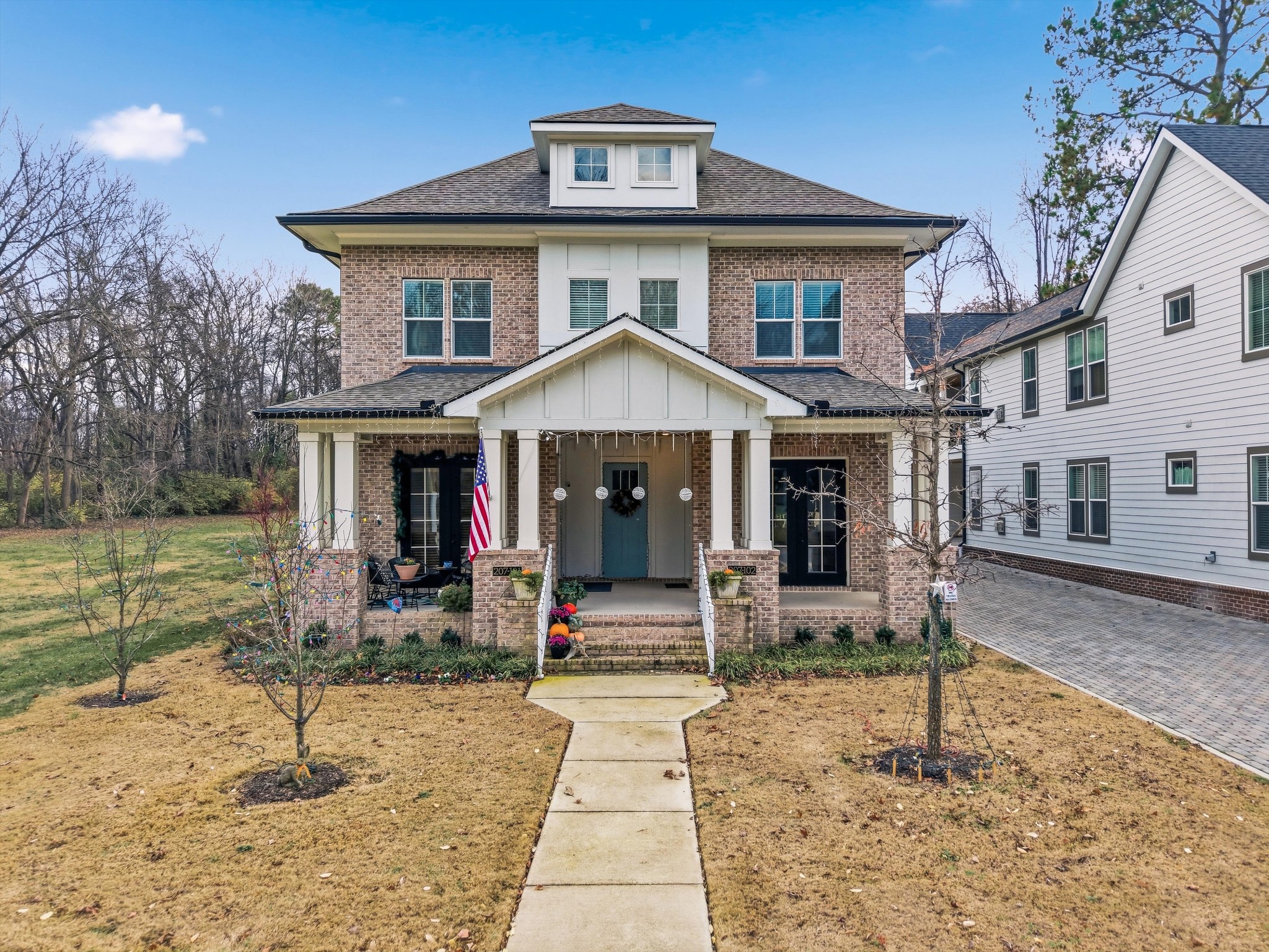 a view of a house with backyard porch and sitting area