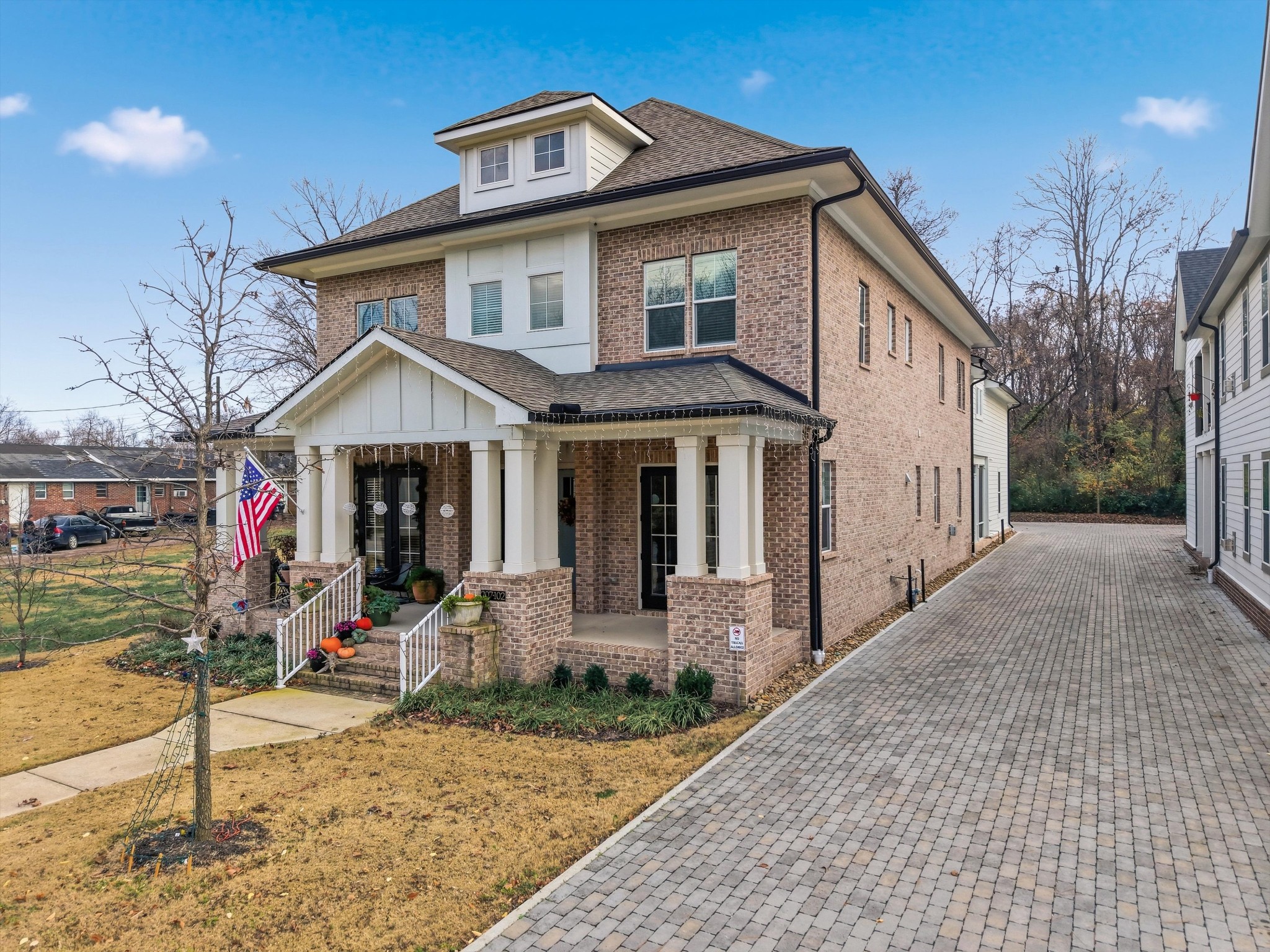 207 Fairground Street, Unit 102 Franklin, TN 37064 - Photo 2 of 70 a front view of a house with a yard