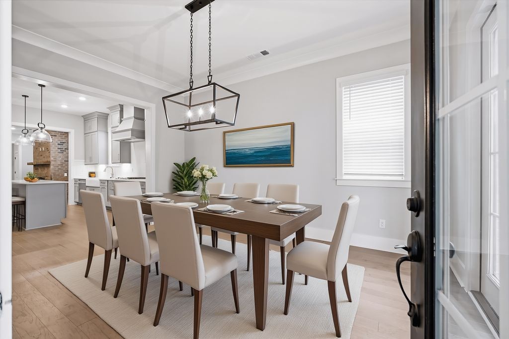 207 Fairground Street, Unit 102 Franklin, TN 37064 - Photo 10 of 70 a view of a dining room with furniture window and wooden floor