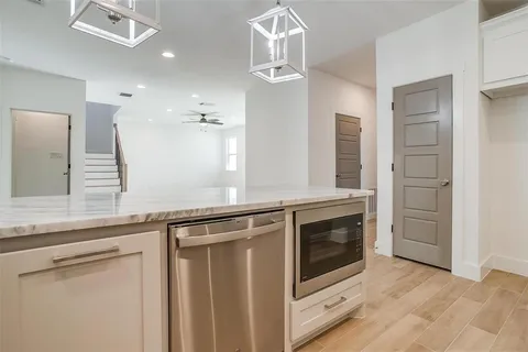 a view of a kitchen with a sink and dishwasher a kitchen view
