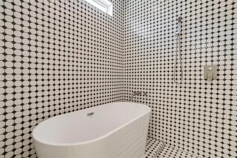 a bathroom with a bathtub and a sink