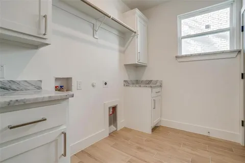 a view of a kitchen with cabinets appliances