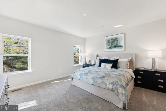 a bedroom with a bed and a cabinets