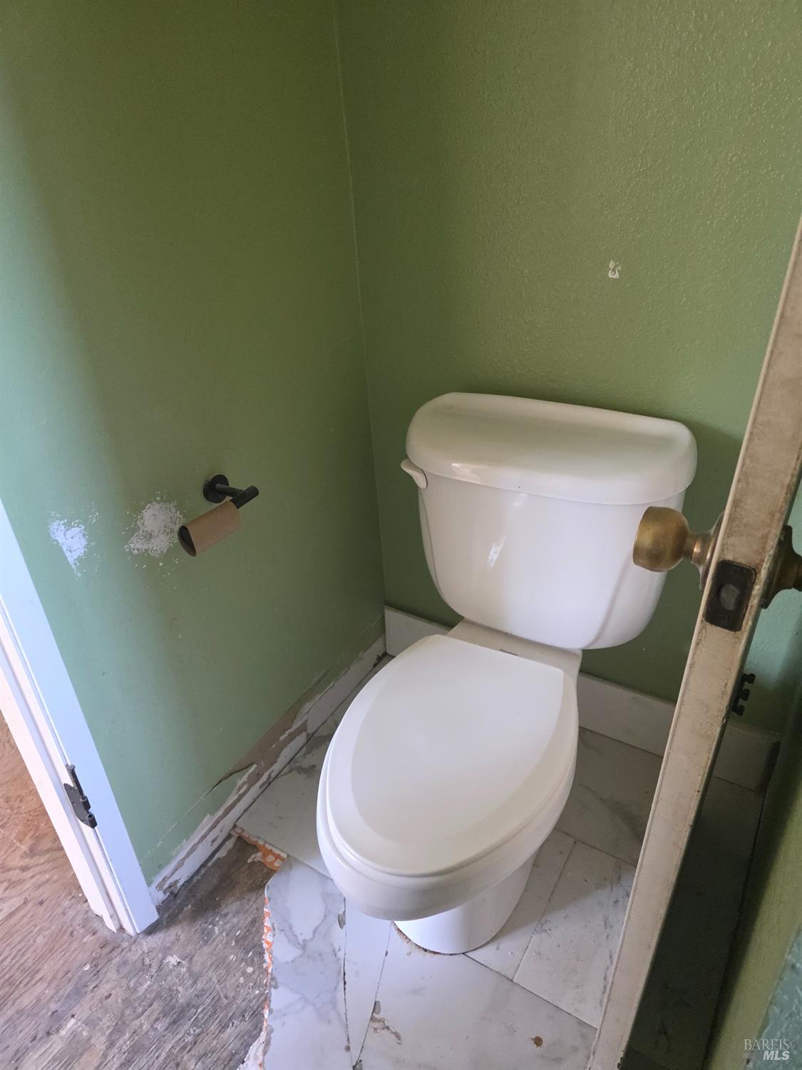 6375 San Benito Way Rohnert Park, CA 94928 - Photo 6 of 24 a white toilet sitting next to a bathroom sink