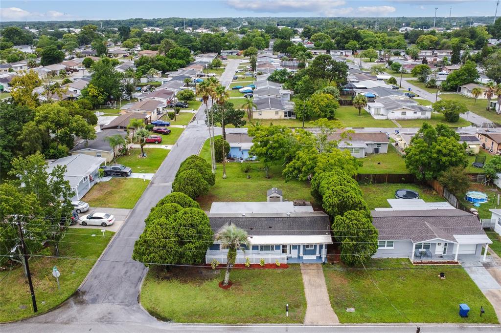 6436 Stone Road Port Richey, FL 34668 - Photo 1 of 1 an aerial view of a house with a yard and lake view