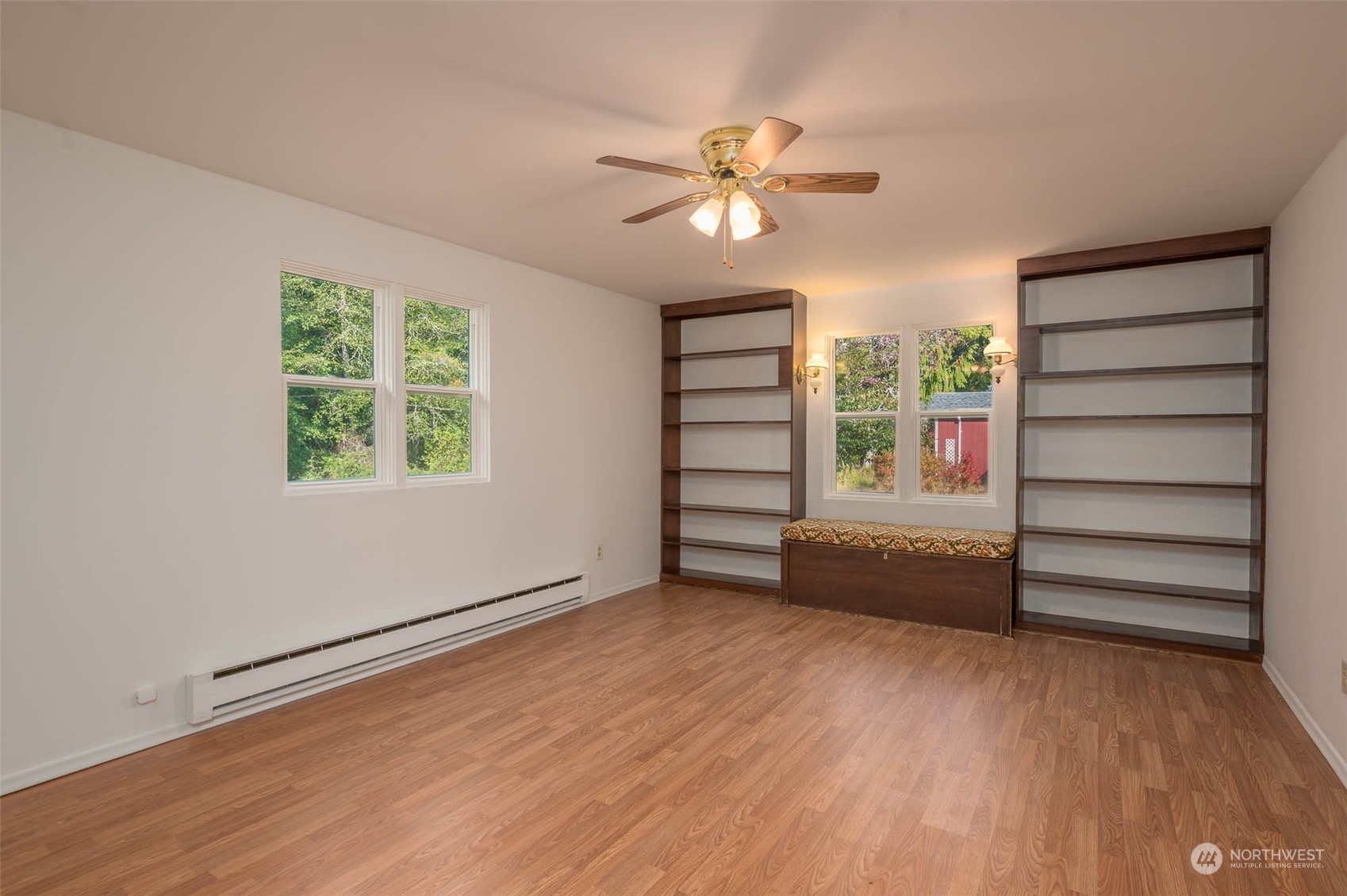 10530 Southwest Cove Road Vashon, WA 98070 - Photo 13 of 34 wooden floor in an empty room with a window