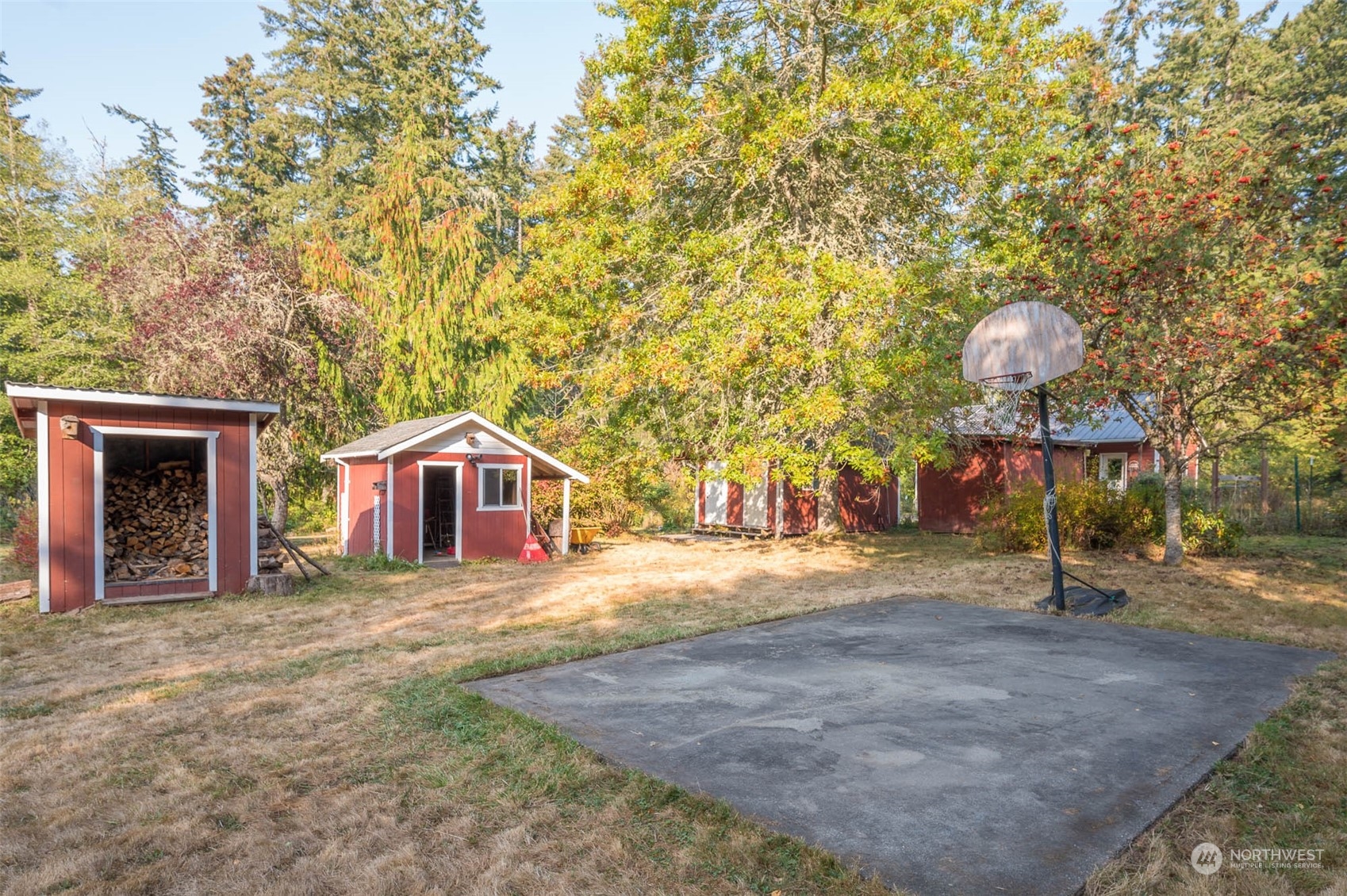 10530 Southwest Cove Road Vashon, WA 98070 - Photo 18 of 34 a front view of a house with a yard and garage
