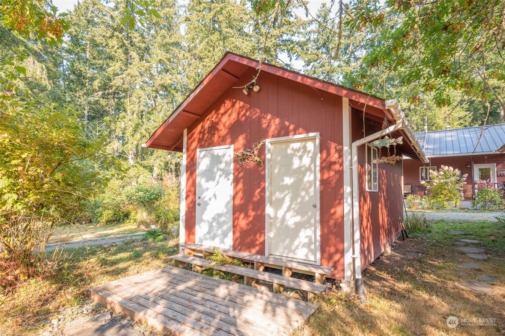 10530 Southwest Cove Road Vashon, WA 98070 - Photo 21 of 34 a backyard of a house with barbeque oven