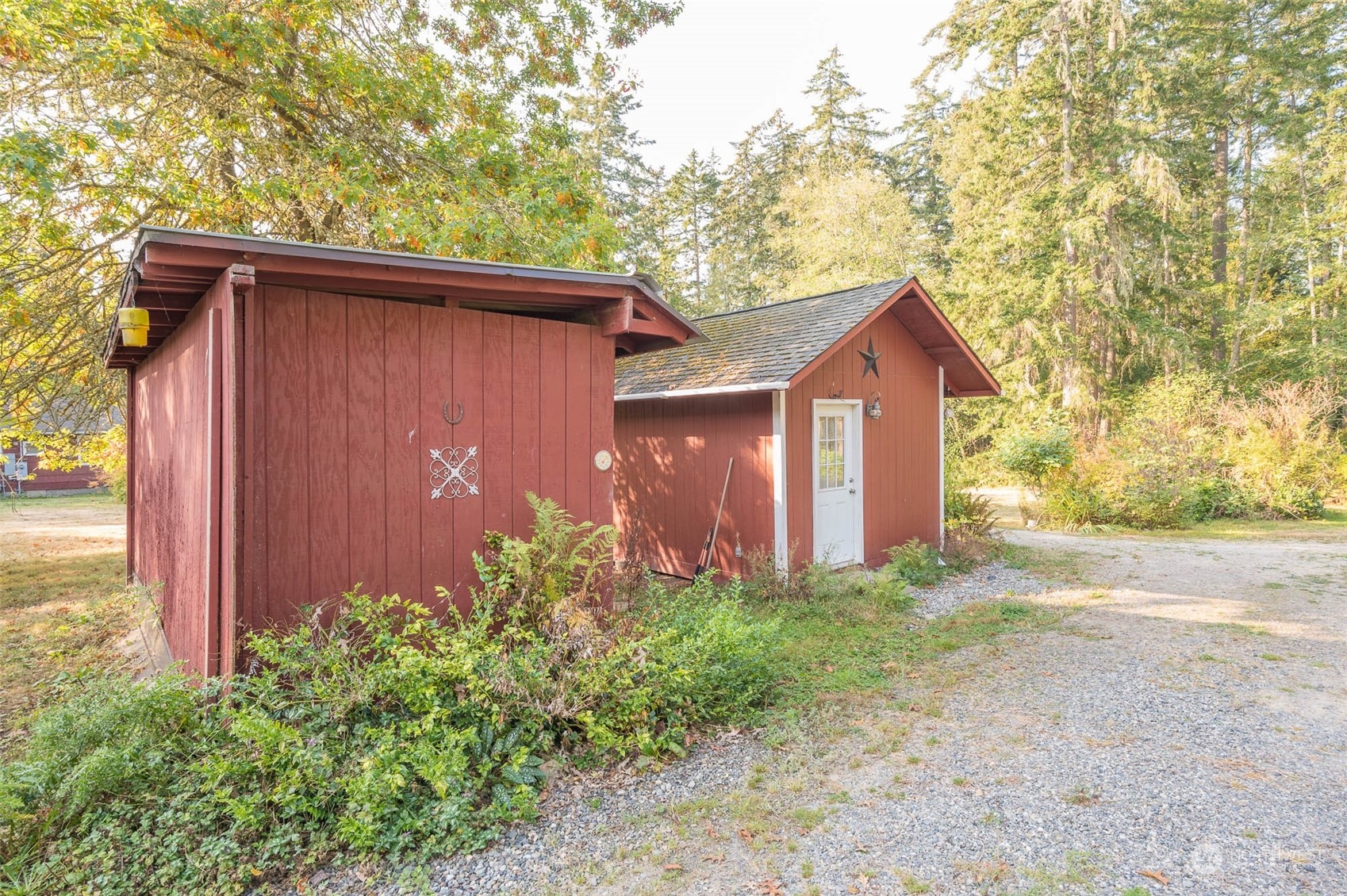 10530 Southwest Cove Road Vashon, WA 98070 - Photo 24 of 34 a backyard of a house with lots of green space