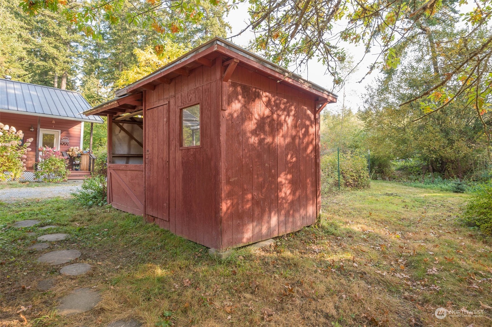 10530 Southwest Cove Road Vashon, WA 98070 - Photo 25 of 34 a backyard of a house with lots of green space