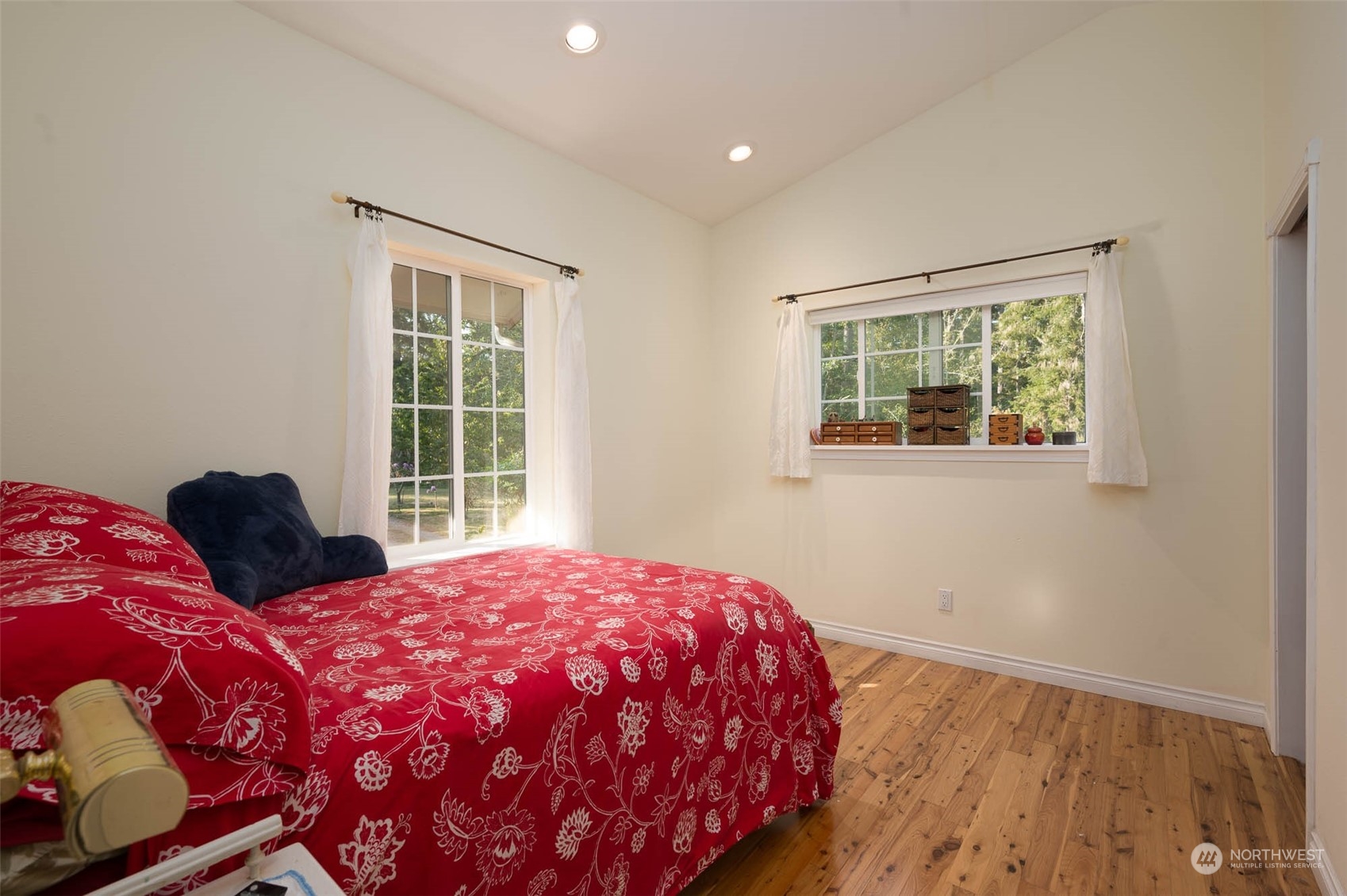10530 Southwest Cove Road Vashon, WA 98070 - Photo 30 of 34 a bedroom with a bed and a window