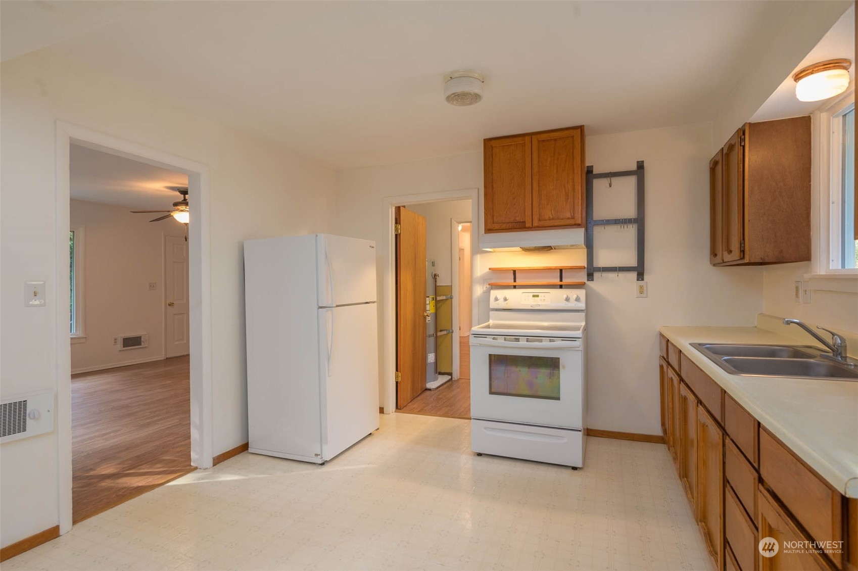 10530 Southwest Cove Road Vashon, WA 98070 - Photo 4 of 34 a kitchen with stainless steel appliances granite countertop a refrigerator and a stove top oven