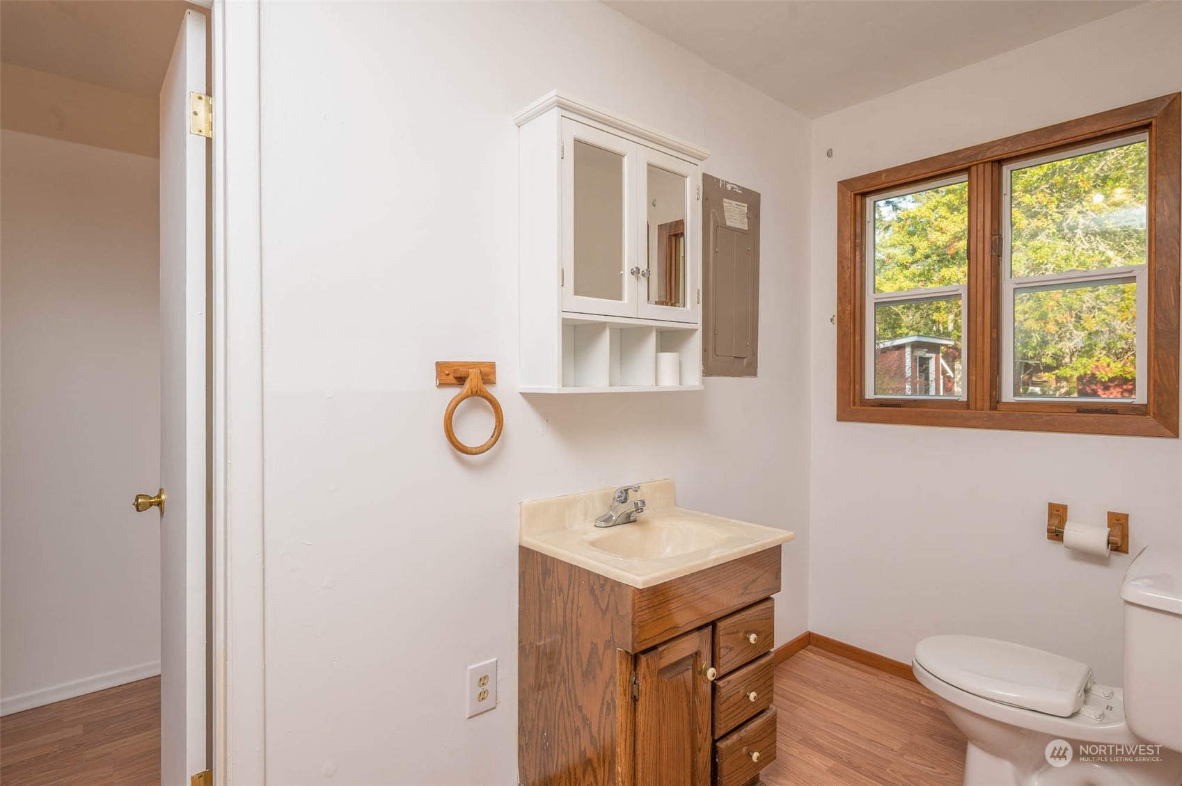 10530 Southwest Cove Road Vashon, WA 98070 - Photo 6 of 34 a bathroom with a sink a toilet and a window