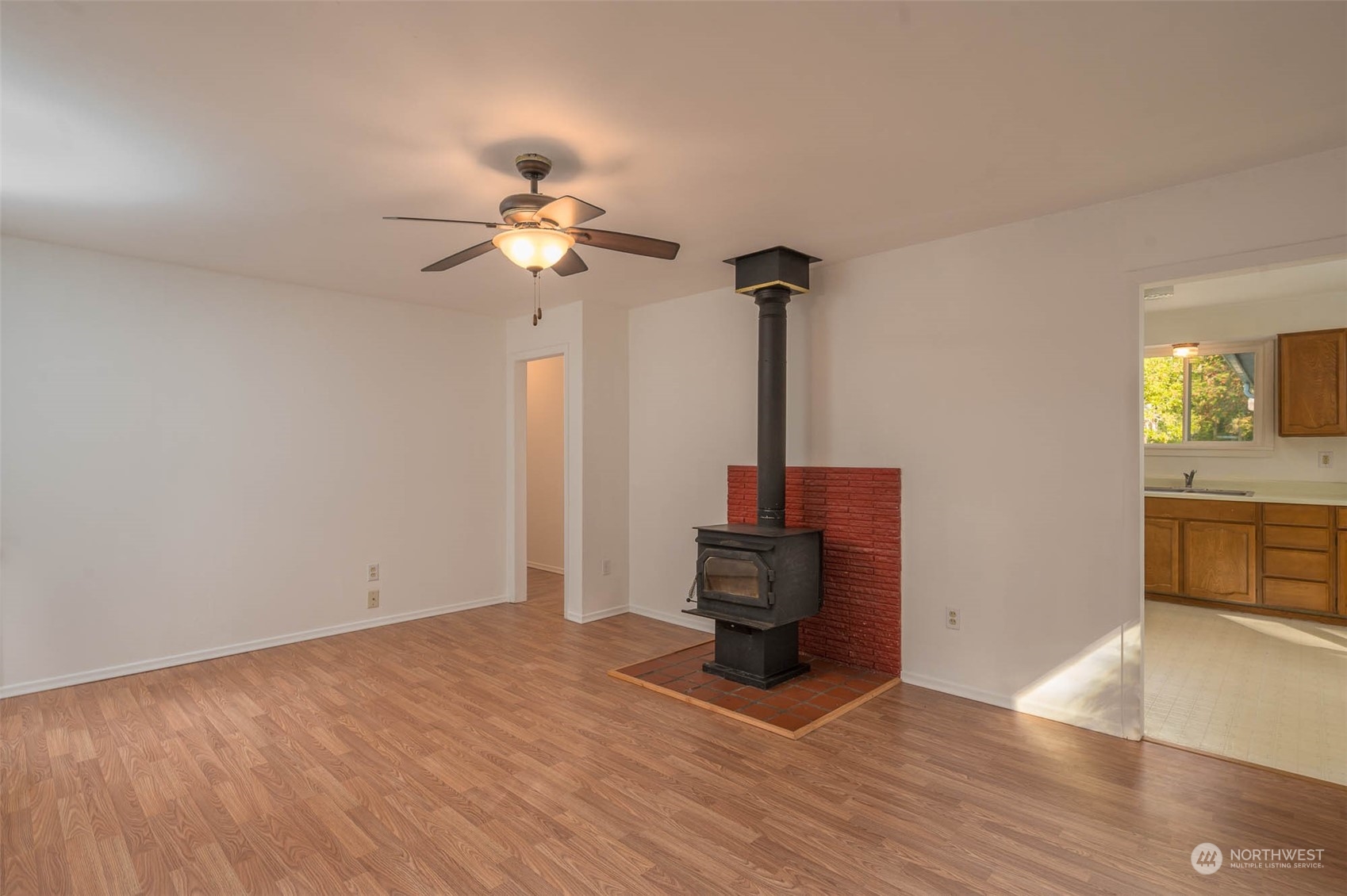10530 Southwest Cove Road Vashon, WA 98070 - Photo 9 of 34 a view of empty room with wooden floor and fan