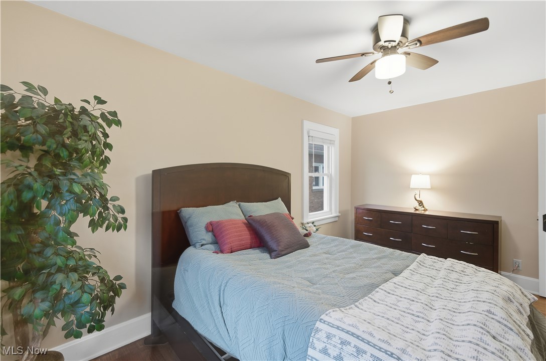 1017 Spring Road Cleveland, OH 44109 - Photo 27 of 47 Bedroom with a ceiling fan and dark wood-type flooring
