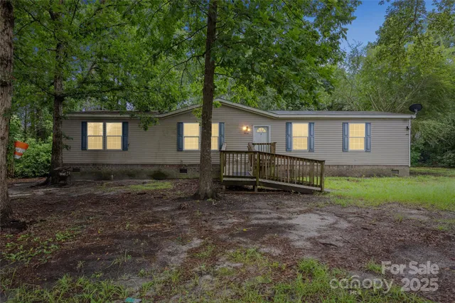 a house view with a backyard space