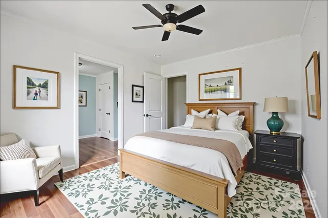 a bedroom with a bed and a couch