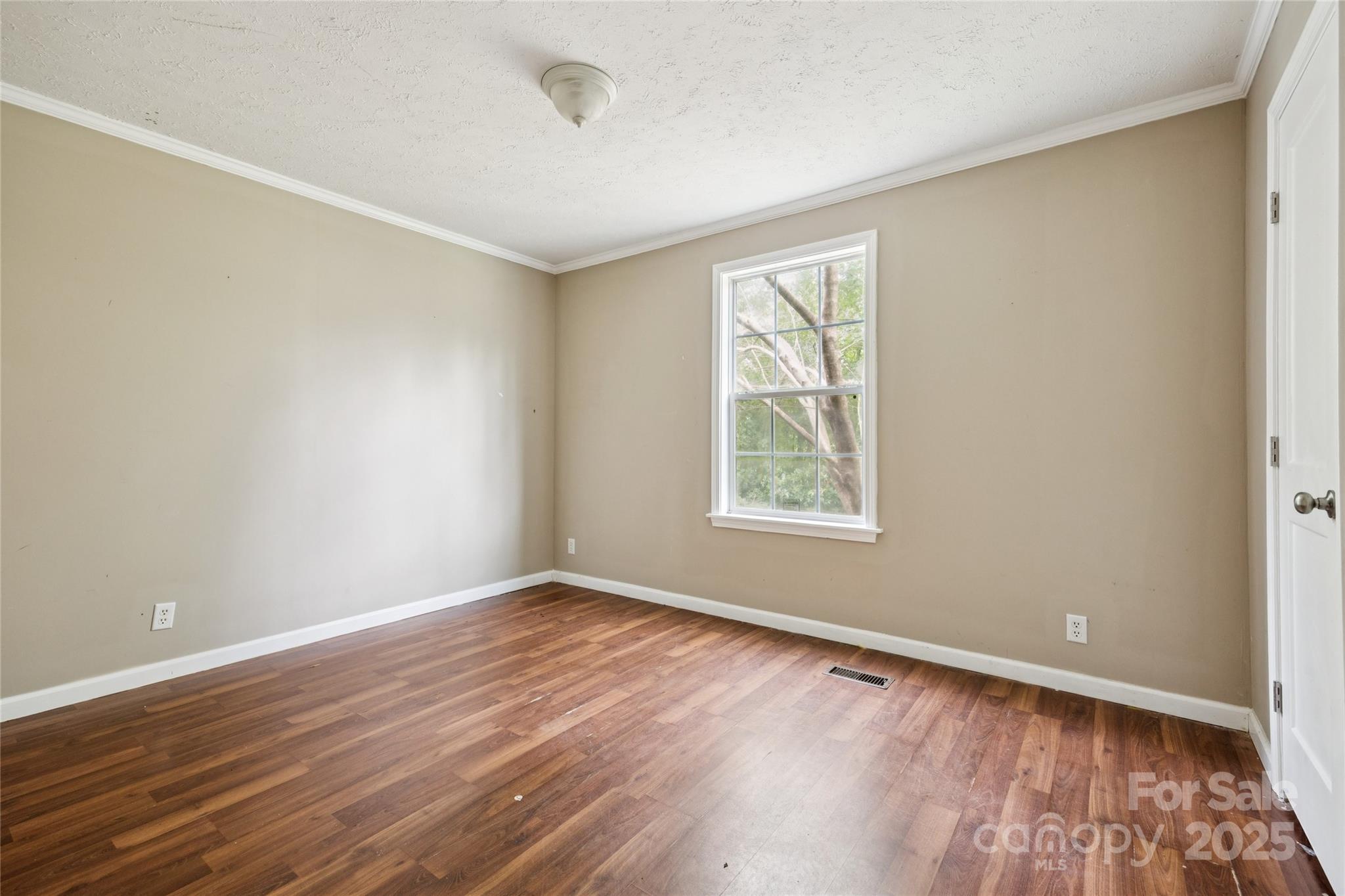 4066 General Howe Road Riegelwood, NC 28456 - Photo 16 of 27 an empty room with wooden floor and windows