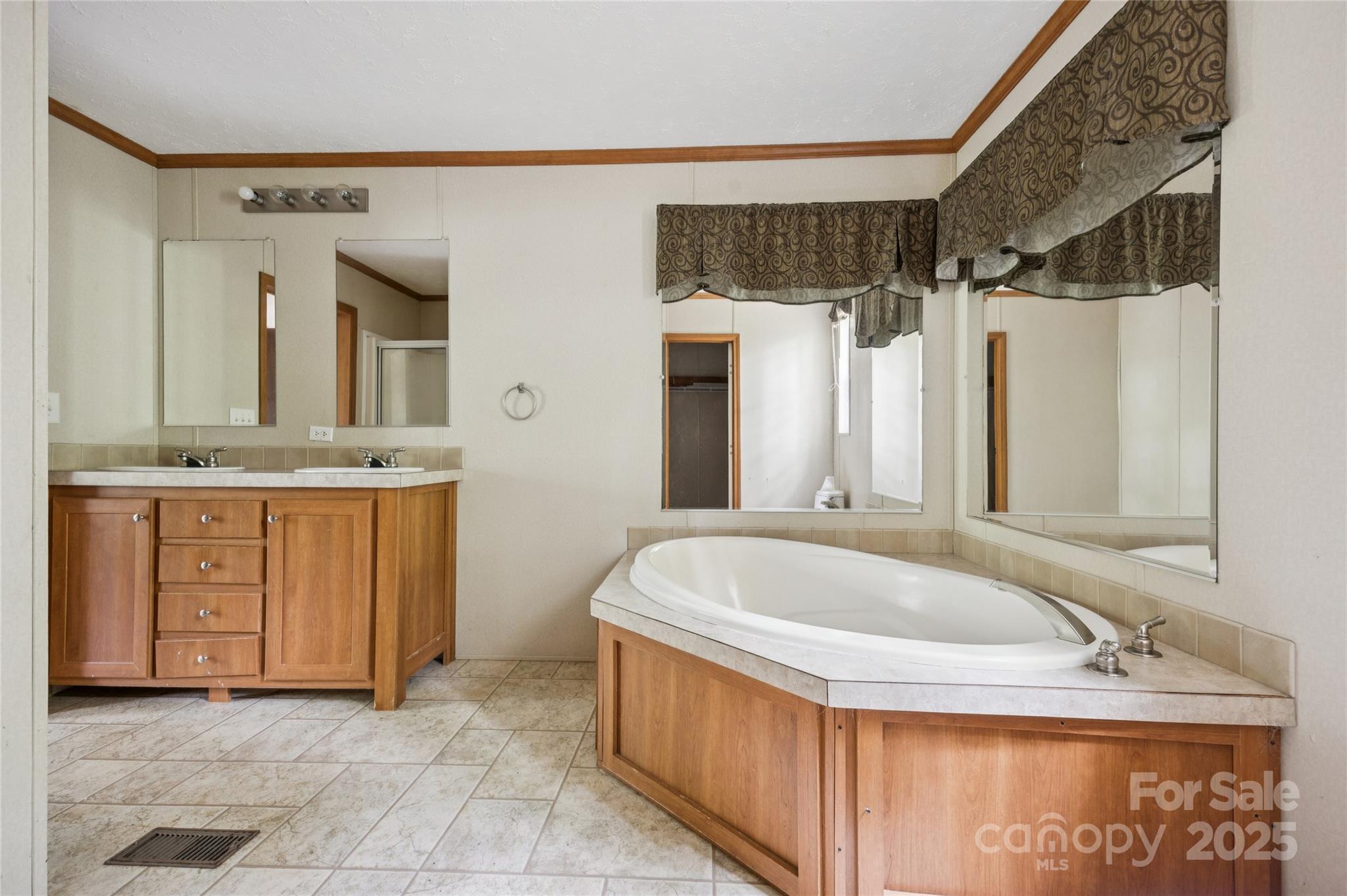 4066 General Howe Road Riegelwood, NC 28456 - Photo 21 of 27 a bathroom with a tub sink and mirror
