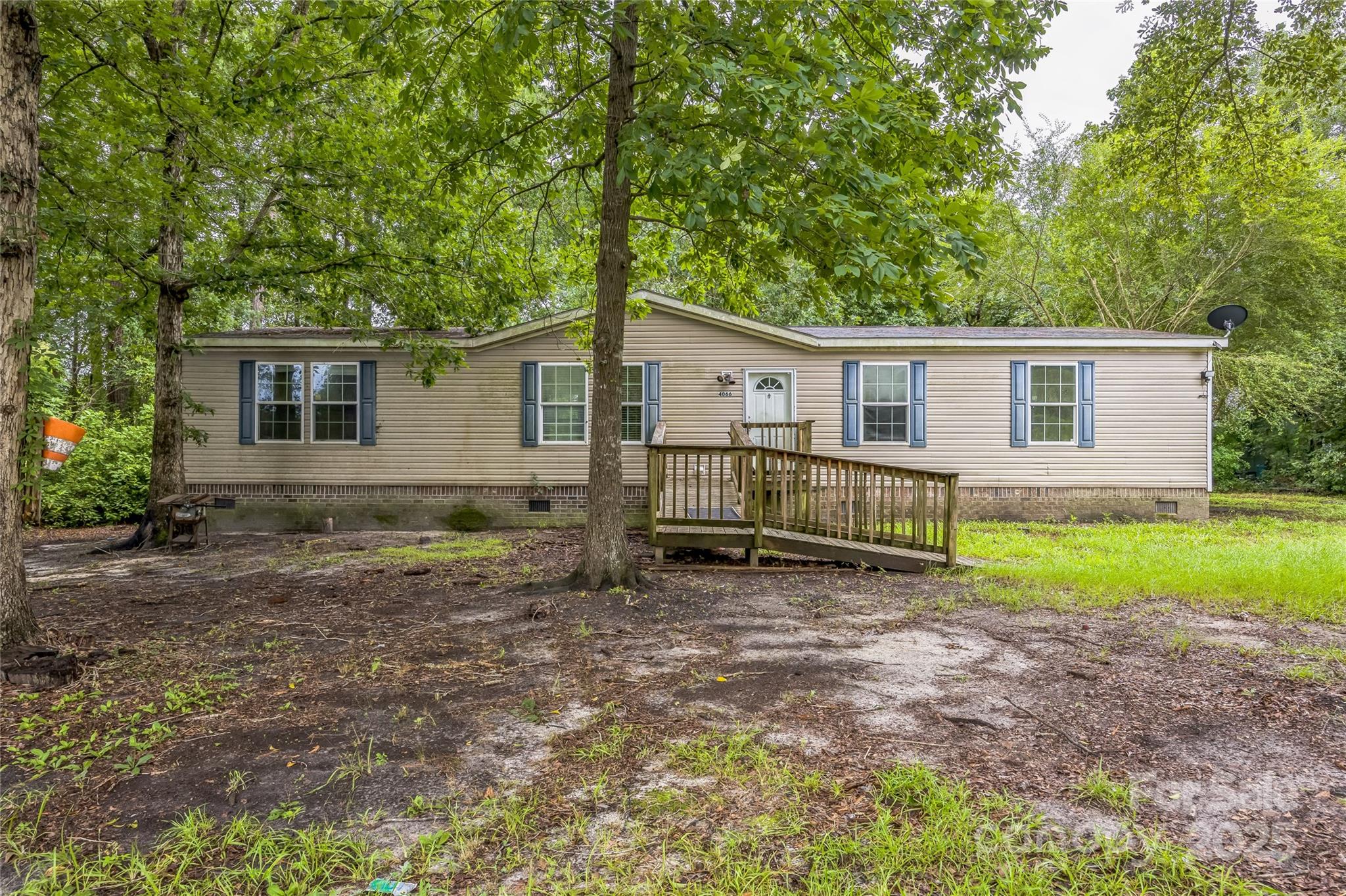 4066 General Howe Road Riegelwood, NC 28456 - Photo 24 of 27 front view of a house with a yard