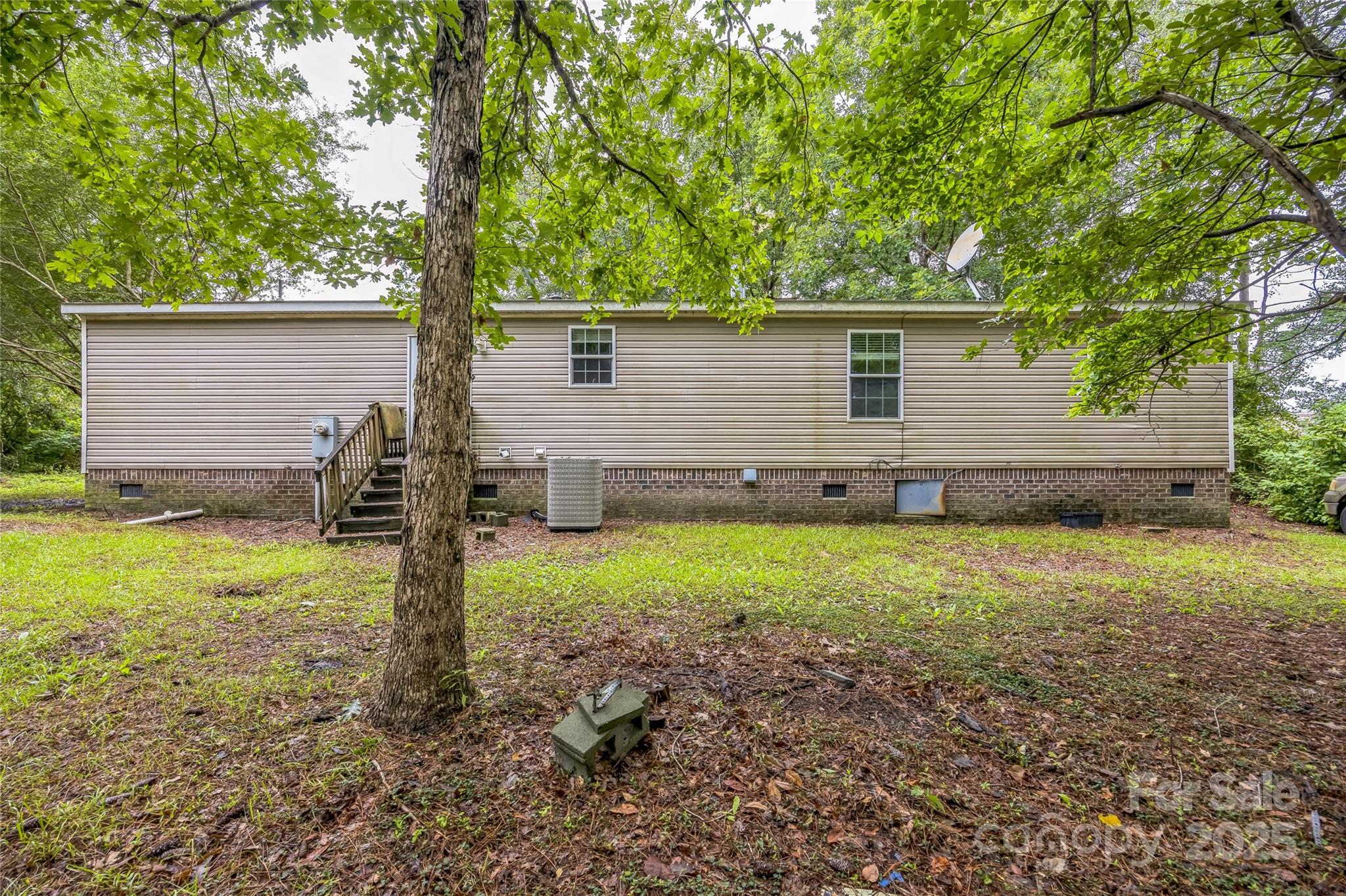 4066 General Howe Road Riegelwood, NC 28456 - Photo 25 of 27 a backyard of a house with lots of green space
