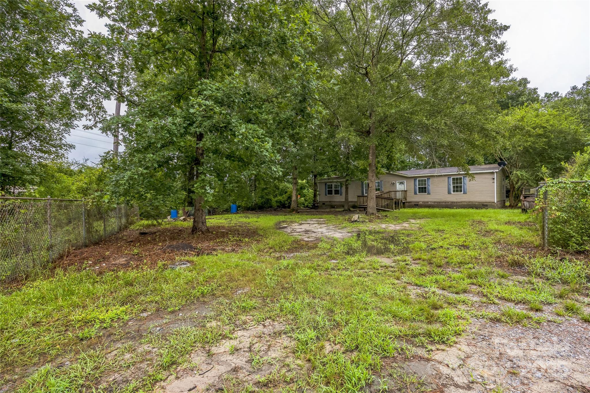 4066 General Howe Road Riegelwood, NC 28456 - Photo 26 of 27 a view of a house with a yard