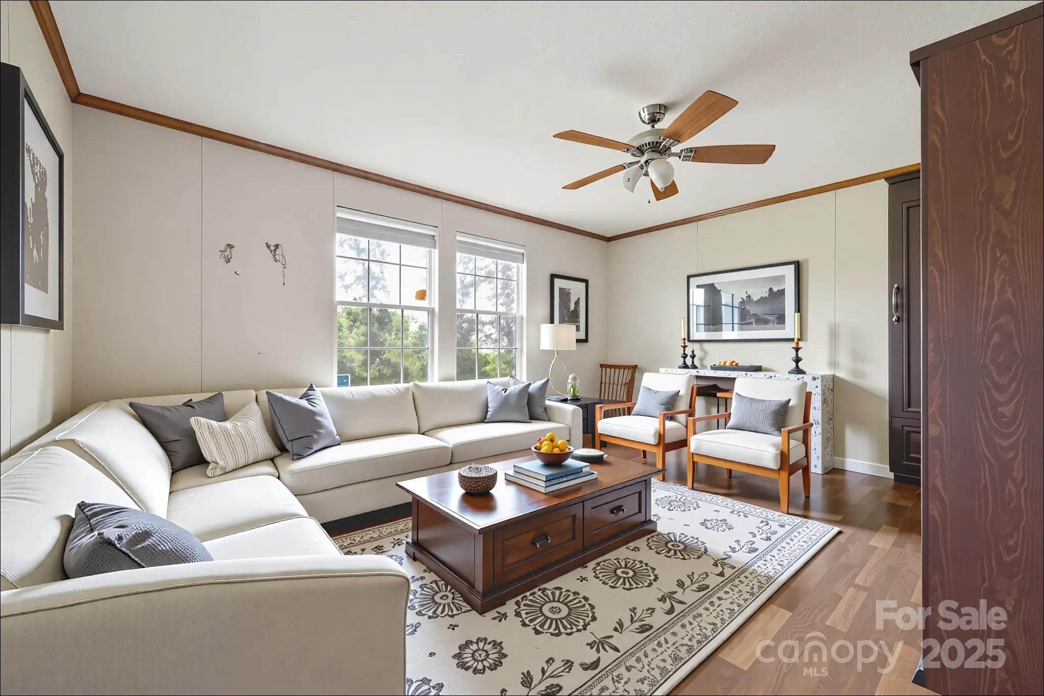 4066 General Howe Road Riegelwood, NC 28456 - Photo 3 of 27 a living room with furniture ceiling fan and a window