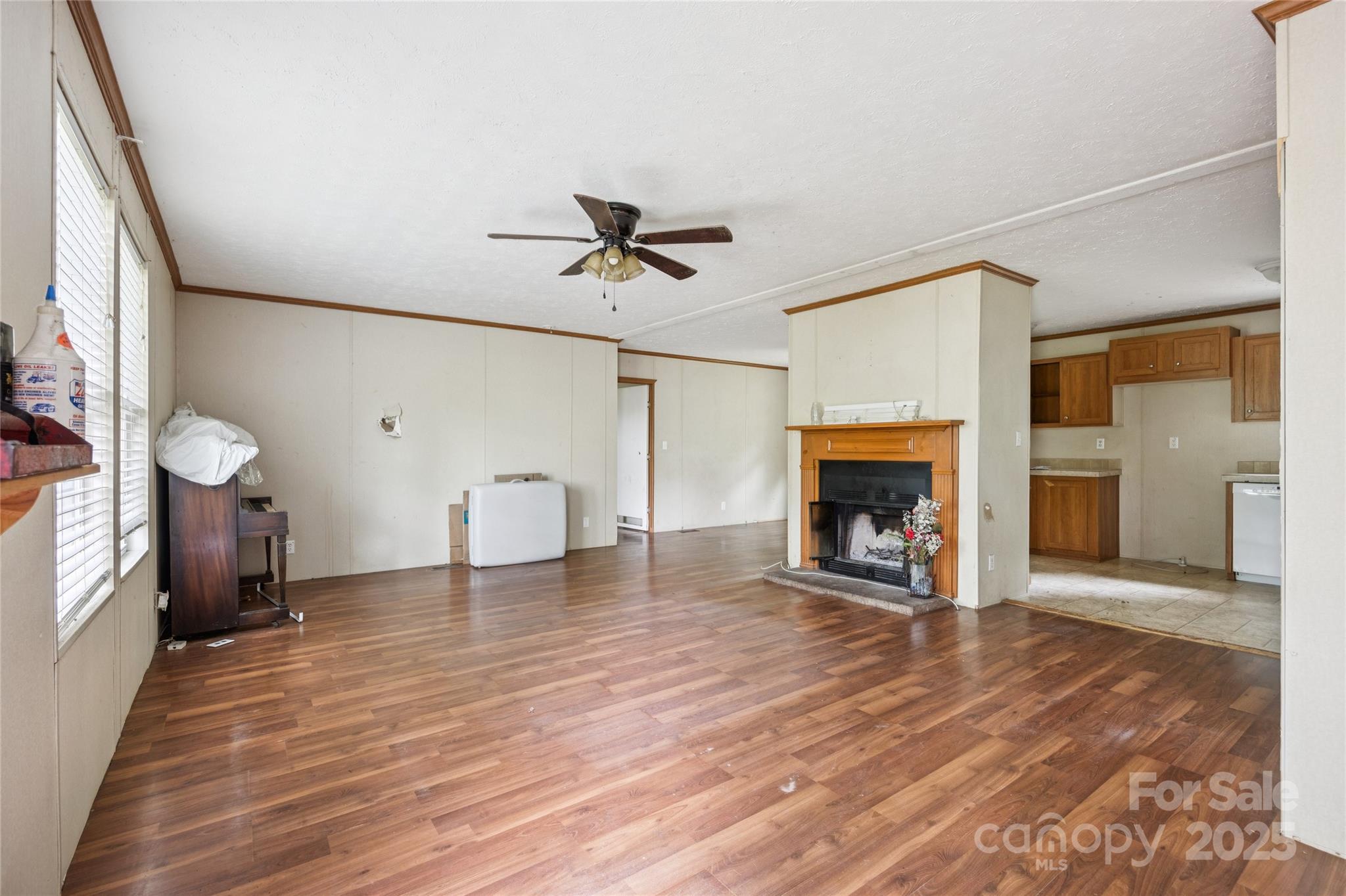 4066 General Howe Road Riegelwood, NC 28456 - Photo 4 of 27 a view of an empty room with a fireplace and a window