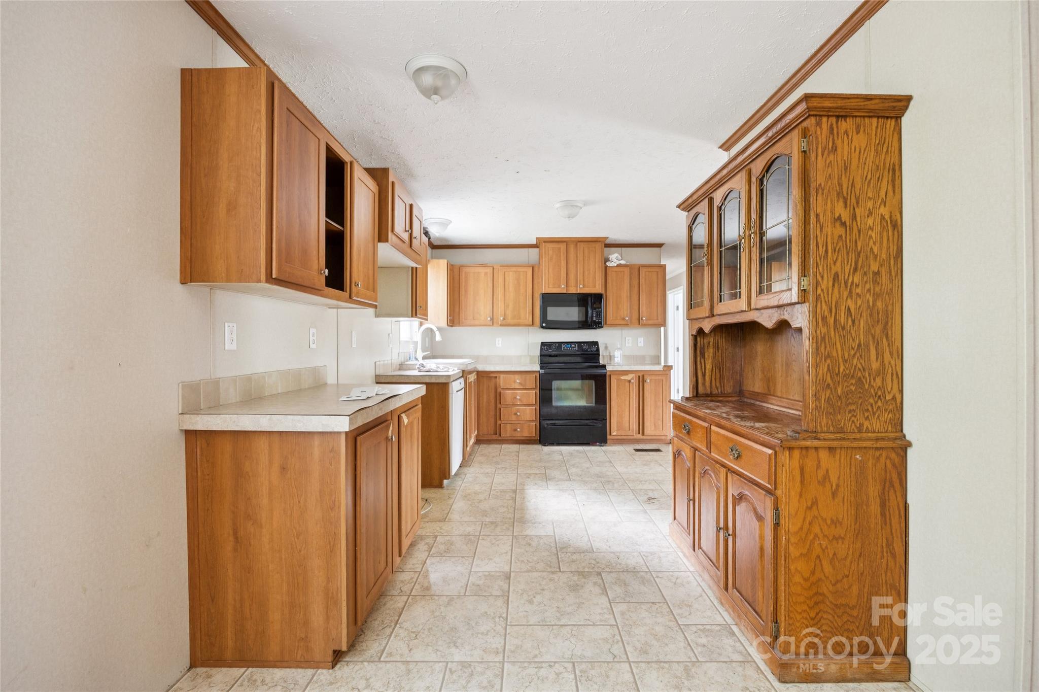 4066 General Howe Road Riegelwood, NC 28456 - Photo 9 of 27 a kitchen with stainless steel appliances granite countertop a refrigerator and a sink