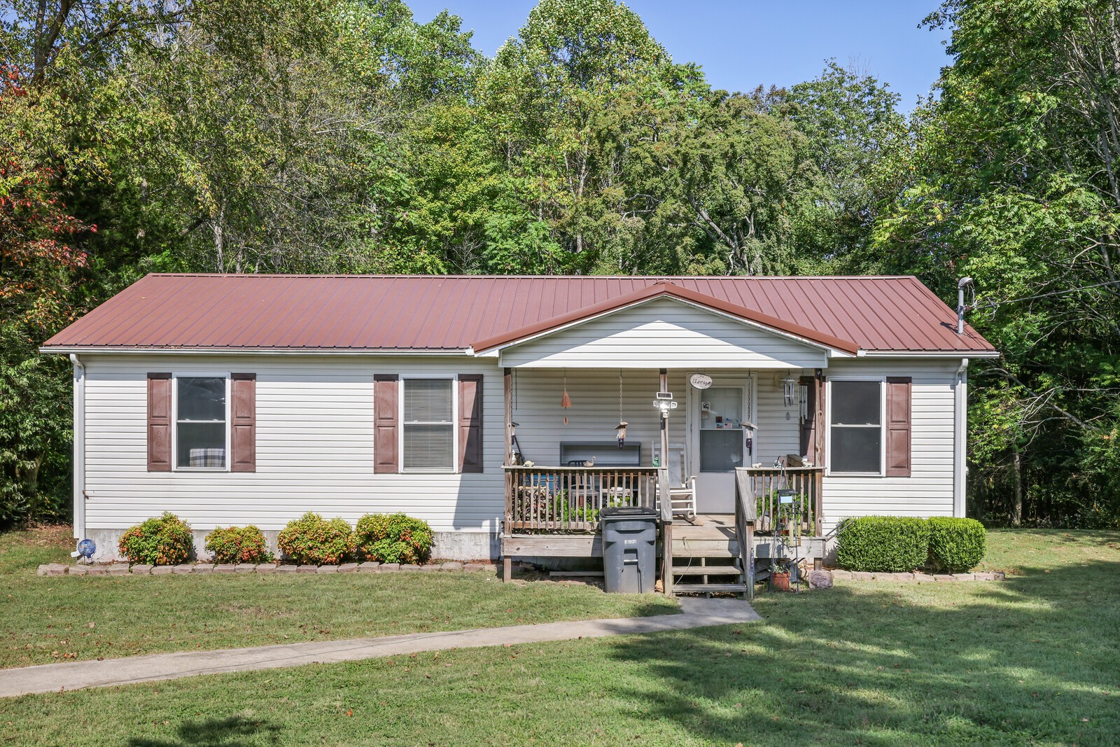 634 Bennett Hill Road Red Boiling Springs, TN 37150 - Photo 1 of 44 a front view of a house with a garden
