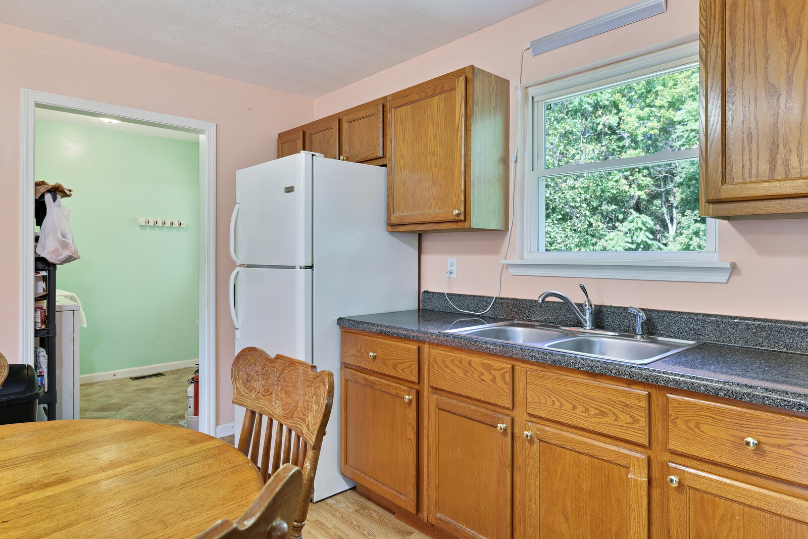 634 Bennett Hill Road Red Boiling Springs, TN 37150 - Photo 12 of 44 a kitchen with granite countertop cabinets stainless steel appliances a sink and a window