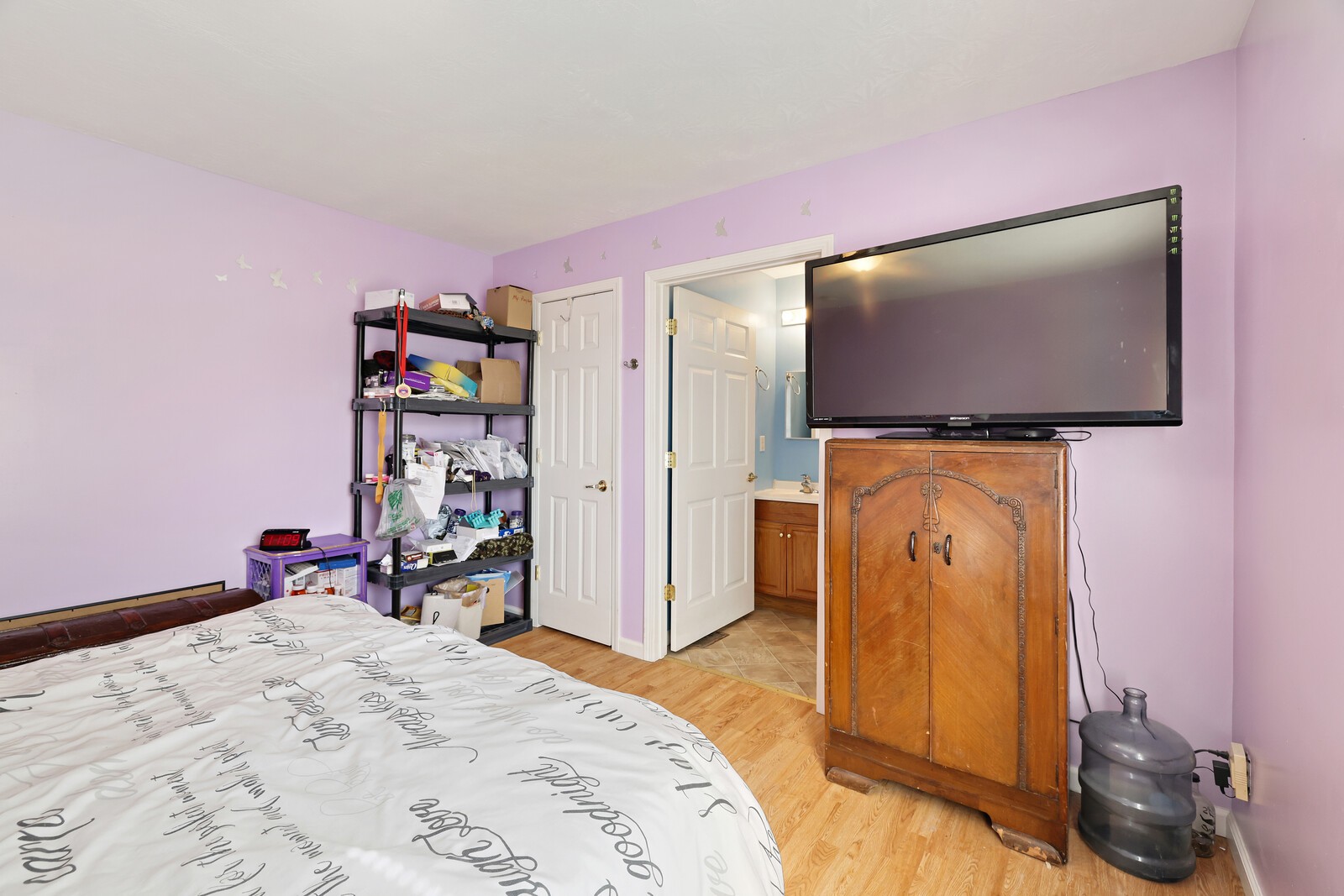 634 Bennett Hill Road Red Boiling Springs, TN 37150 - Photo 18 of 44 a bedroom with a bed and a flat screen tv