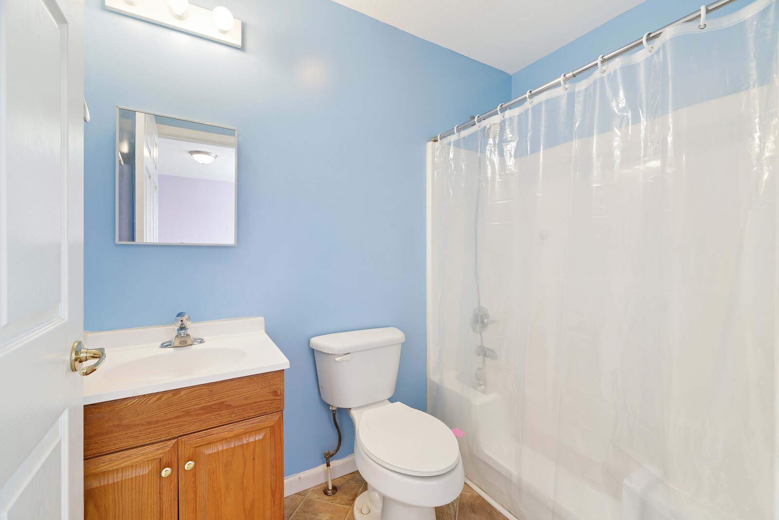 634 Bennett Hill Road Red Boiling Springs, TN 37150 - Photo 19 of 44 a white toilet sitting next to a bathroom sink