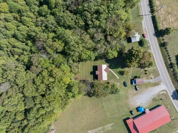 a picture of a bench in front of a wall