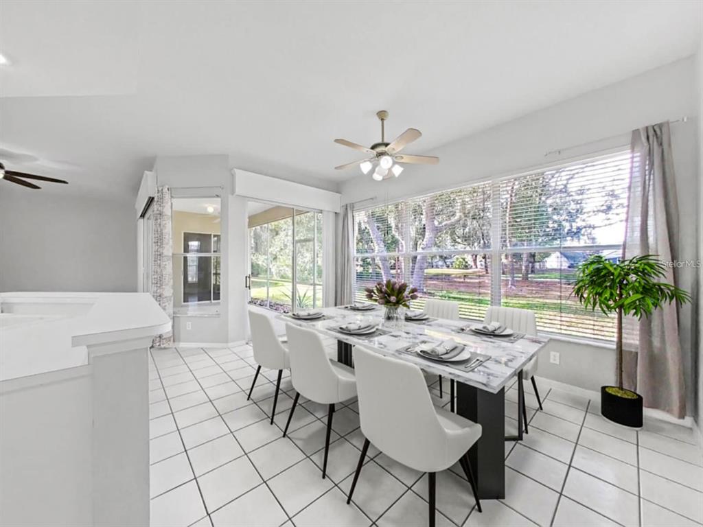 3307 Kilmer Place Plant City, FL 33566 - Photo 13 of 32 a view of a dining room with furniture window and outside view