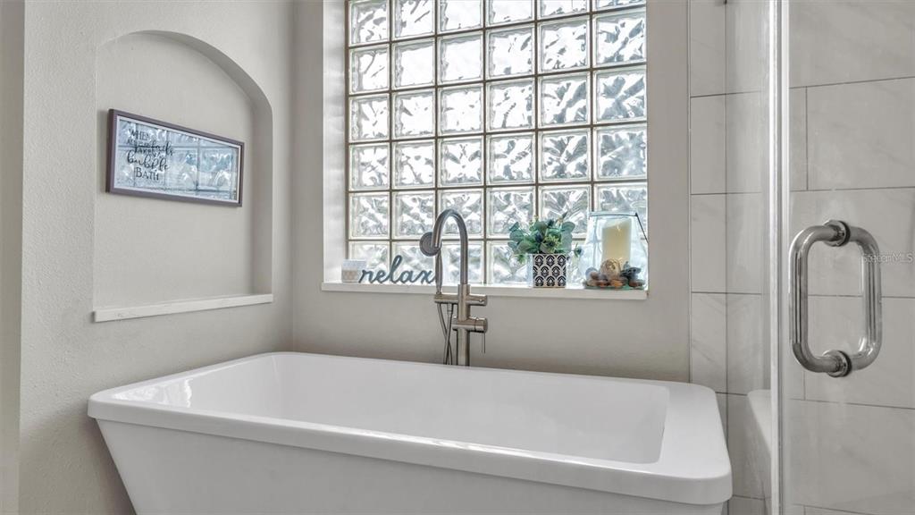 3307 Kilmer Place Plant City, FL 33566 - Photo 18 of 32 a white bath tub sitting next to a window