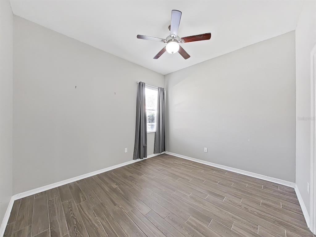 3307 Kilmer Place Plant City, FL 33566 - Photo 23 of 32 a view of an empty room with wooden floor