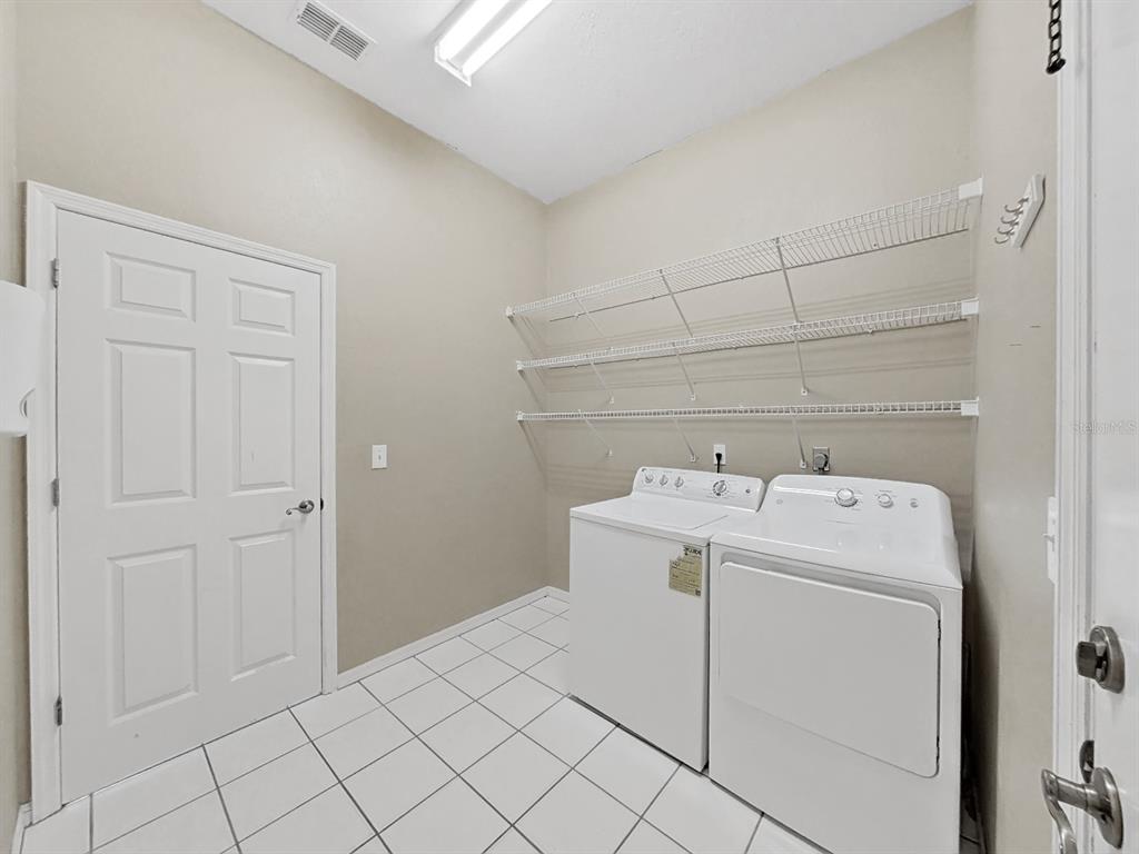 3307 Kilmer Place Plant City, FL 33566 - Photo 25 of 32 a utility room with dryer and washer
