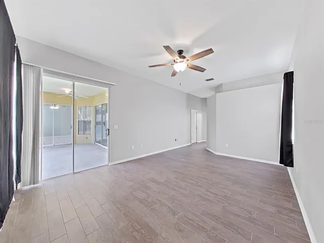 a view of an empty room with a window