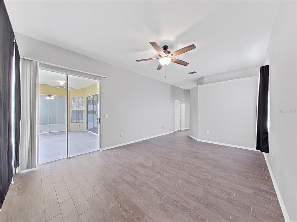 3307 Kilmer Place Plant City, FL 33566 - Photo 9 of 32 a view of an empty room with a window