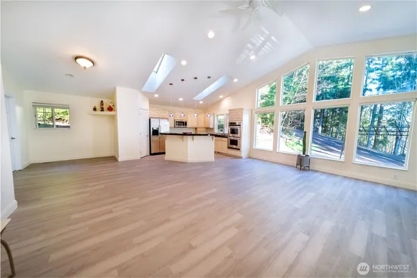 a bed room with a bed and a chair