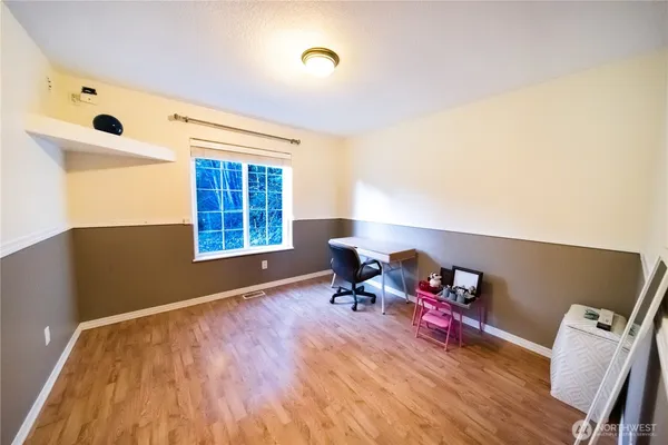 a bedroom with toys and a dresser