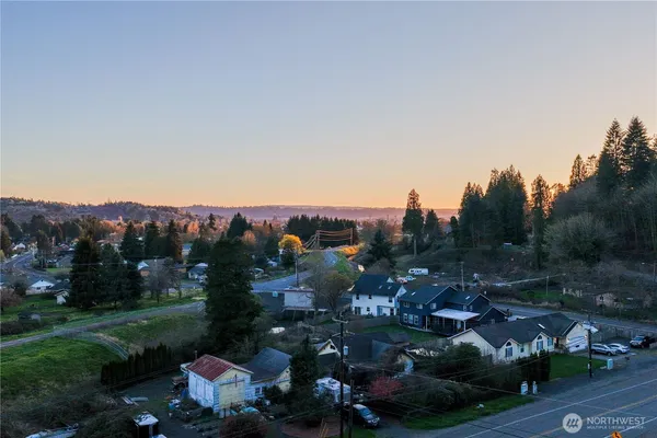 a balcony with furniture and a potted plant