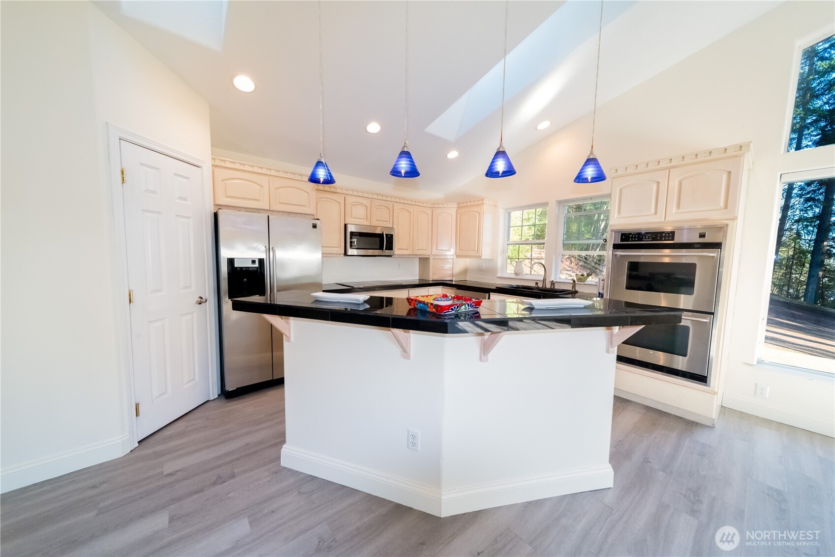 118 Clark Creek Road Longview, WA 98632 - Photo 8 of 19 a kitchen with kitchen island white cabinets and stainless steel appliances