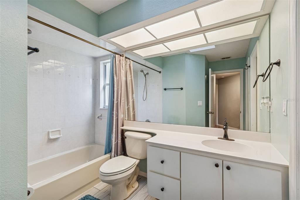 6070 Drexel Road Land O' Lakes, FL 34638 - Photo 13 of 23 a bathroom with a sink a toilet and shower